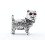 SILVER FIGURE OF A TERRIER DOG WITH GREEN AND PINK STONES.