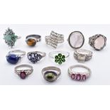 TWELVE SILVER STONE SET RINGS