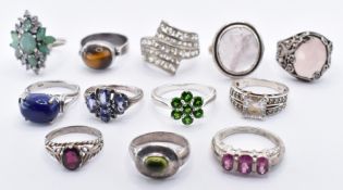 TWELVE SILVER STONE SET RINGS