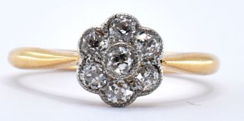 18CT GOLD AND DIAMOND FLOWER HEAD RING