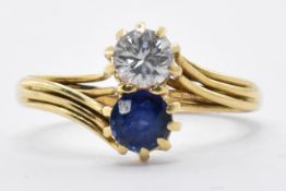 18CT GOLD DIAMOND AND SAPPHIRE CROSSOVER RING