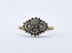 9CT GOLD WHITE STONE AND DIAMOND CLUSTER RING.