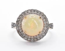 9CT GOLD OPAL AND WHITE STONE RING