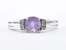 9CT WHITE GOLD AND PURPLE STONE RING