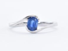 9CT WHITE GOLD AND SAPPHIRE CROSSOVER RING