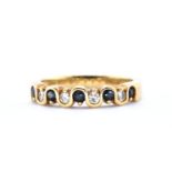 18KT GOLD DIAMOND AND BLUE STONE RING.