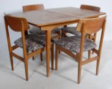 MID 20TH CENTURY TEAK WOOD EXTENDING DINING TABLE AND FOUR CHAIRS