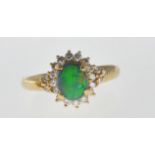 18CT GOLD BLACK OPAL AND DIAMOND RING