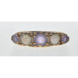 9CT GOLD RING SET WITH OPAL CABOCHONS AND PURPLE STONES.