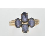 HALLMARKED 9CT GOLD AND PURPLE STONE RING.