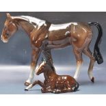 PAIR OF BROWN BESWICK HORSE FIGURINES.