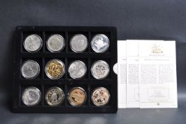 COLLECTION OF TWELVE SILVER AND OTHER COINS