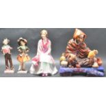 GROUP OF FOUR ROYAL DOULTON FIGURINES