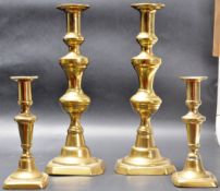 TWO PAIRS OF EARLY 20TH CENTURY BRASS SINGLE SCONCE CANDLESTICKS