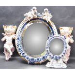 TWO CERAMIC CHERUB MIRRORS & PAIR OF WALL POCKETS