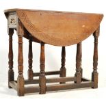EARLY 20TH CENTURY OAK CARVED DROP LEAF DINING TABLE