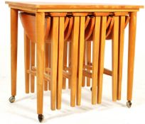 MID CENTURY FOLDING NEST OF TABLES IN THE MANNER OF POUL HUNDEVAD