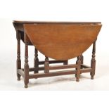 1930S OAK OVAL GATE LEG TABLE.