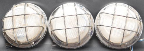 THREE 1980’S INDUSTRIAL FACTORY WALL WIRED CAGE LIGHTS