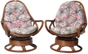 MATCHING PAIR OF RETRO WICKER / CANE SWIVEL EGG ARMCHAIR