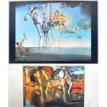 SALVADOR DALI - TWO MID CENTURY COLOURED PRINTS ON BOARD