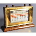 ART DECO OAK AND BRASS FRAMED DESKTOP CALENDAR