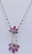 RETRO PLATINUM DIAMOND AND RUBY FLORAL SPRAY NECKLACE