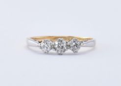 18CT GOLD AND PLATINUM THREE STONE DIAMOND RING