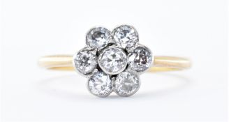 18CT GOLD AND DIAMOND SEVEN STONE RING