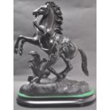 20TH CENTURY VINTAGE SPELTER FIGURINE OF A YOUTH CONTROLLING A REARING HORSE