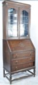 CIRCA 1920S JACOBEAN REVIVAL OAK BUREAU BOOKCASE