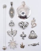 GROUP OF SILVER PENDANTS & CHARMS