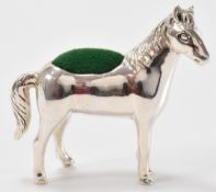 SILVER PIN CUSHION IN THE FORM OF A HORSE