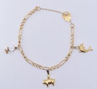 9CT GOLD FIGARO LINK CHARM BRACELET