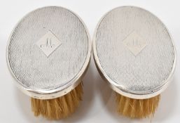 PAIR OF LEVI & SALAMAN SILVER BACKED BRUSHES
