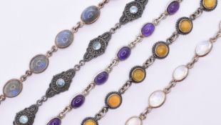 FIVE SILVER STONE SET BRACELETS