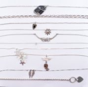 ASSORTMENT OF SILVER PENDANT NECKLACES