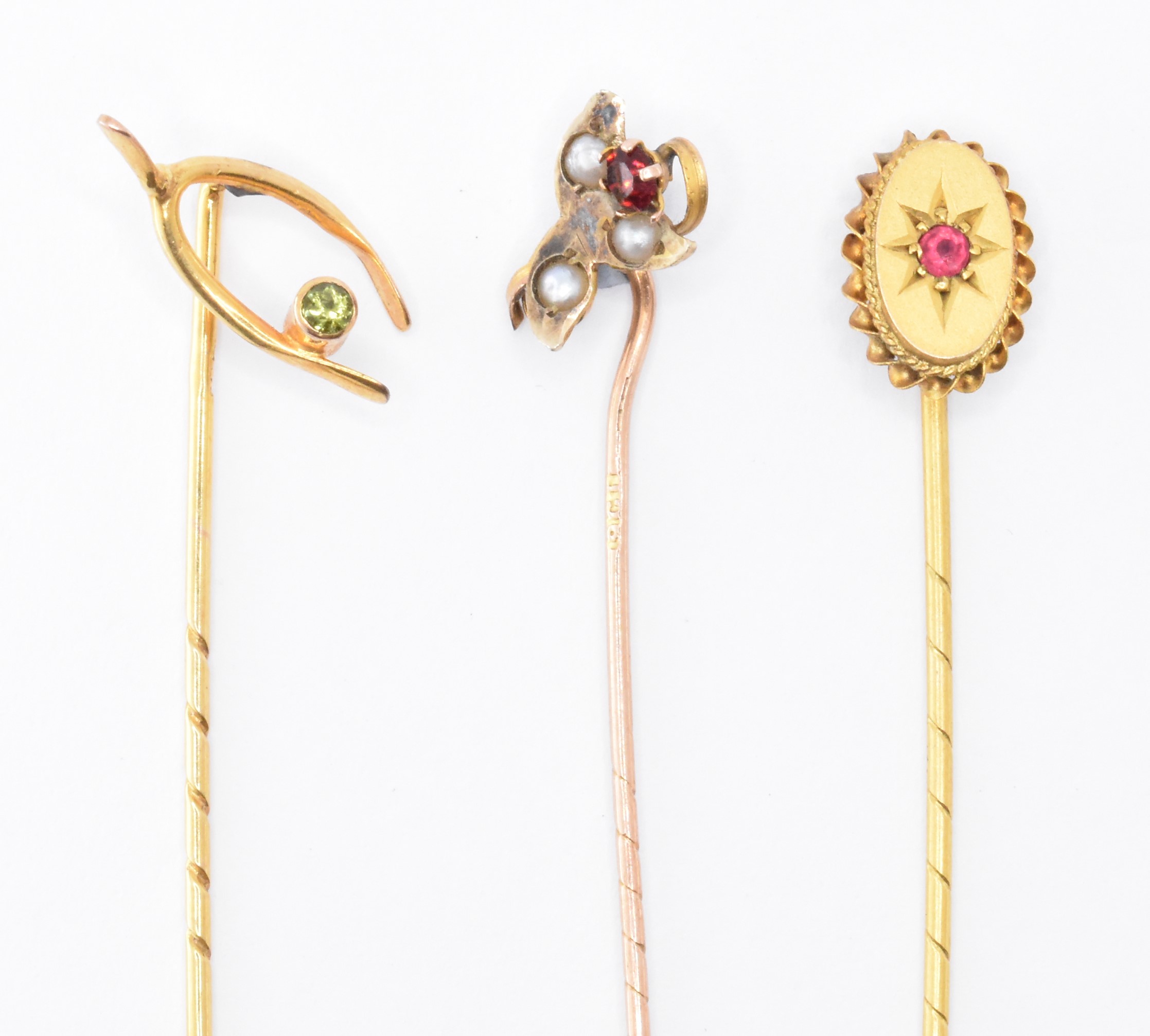 THREE VICTORIAN 9CT GOLD STICK PINS