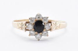 9CT GOLD CUBIC ZIRCONIA & BLACK STONE FLOWERHEAD RING