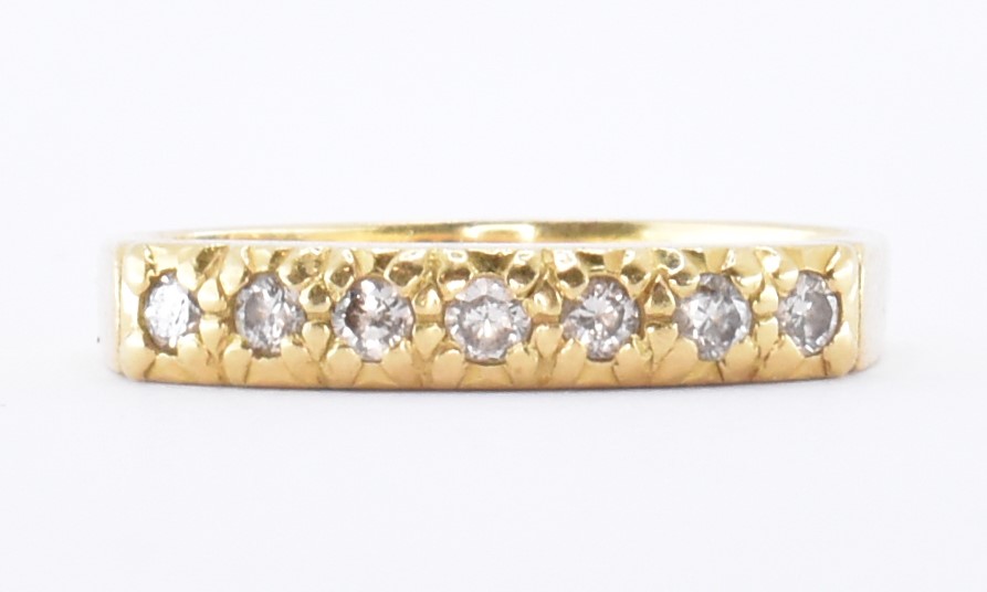 18CT GOLD & DIAMOND SEVEN STONE RING