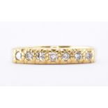 18CT GOLD & DIAMOND SEVEN STONE RING