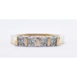 9CT GOLD AND DIAMOND FOUR STONE RING
