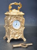 FRENCH ROCOCO STYLE GILT METAL MINATURE CARRIAGE CLOCK