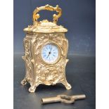 FRENCH ROCOCO STYLE GILT METAL MINATURE CARRIAGE CLOCK
