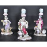 SET OF FOUR CONTINENTAL 20TH CENTURY CANDLESTICKS