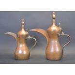 TWO COPPER AND BRASS PERSIAN DALLAH COFFEE POT