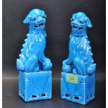 TWO TURQUOISE PORCELAIN CHINESE FOO DOG