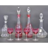 TWO 19TH CENTURY VICTORIAN CRANBERRY GLASS DECANTERS AND SHERRY GLASSES