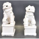 PAIR OF 19TH CERAMIC BLANC DE CHINE / DEHUA CHINESE FOO DOG