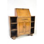 A 1920'S OAK STUDENT BUREAU OFFICE DESK